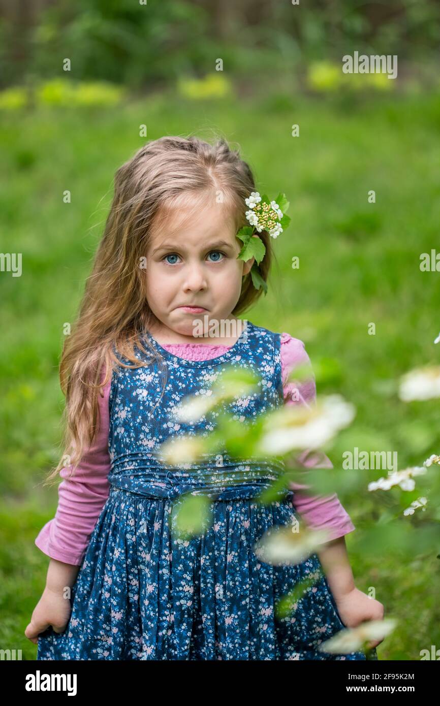 emotional portrait of a surprised girl in a botanical garden near the ...