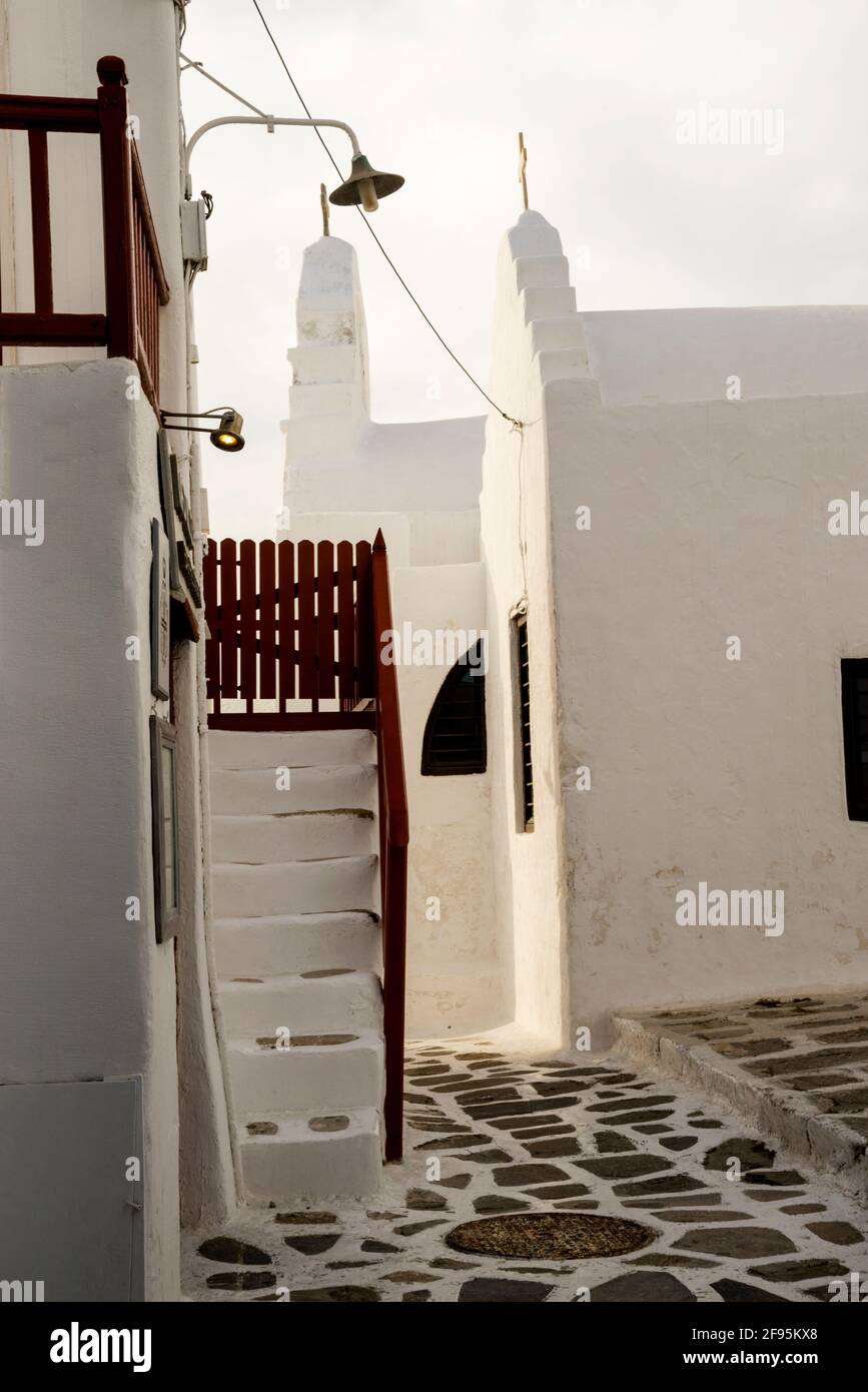 Stepped gables of ancient churches on the Greek Island of Mykonos, a  remote landscape of white Cycladic architecture and vernacular churches. Stock Photo
