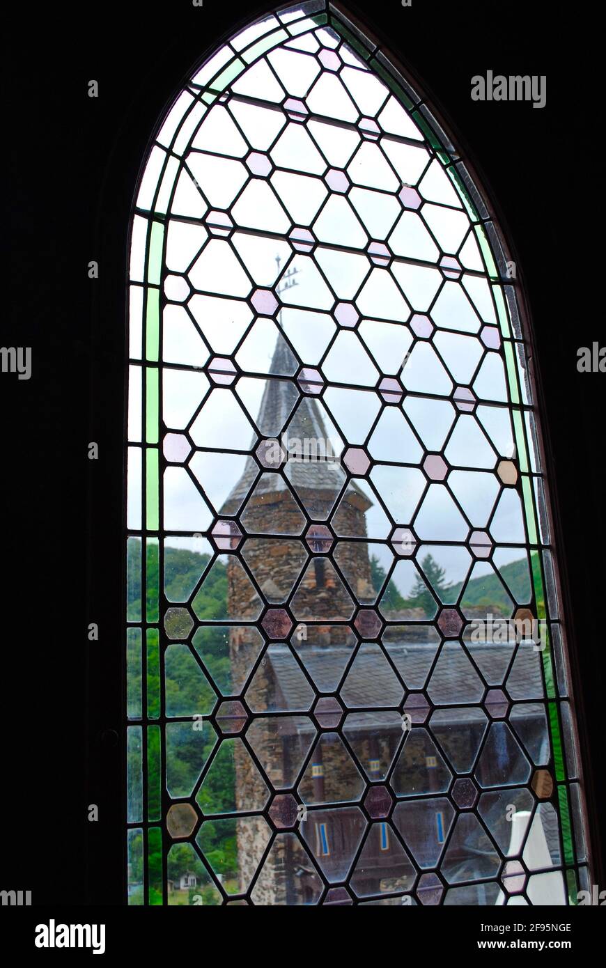 COCHEM, GERMANY: View from inside through window to a castle tower. Interior of the Cochem Castle (Reichsburg or Burg Cochem), on the Moselle River. Stock Photo