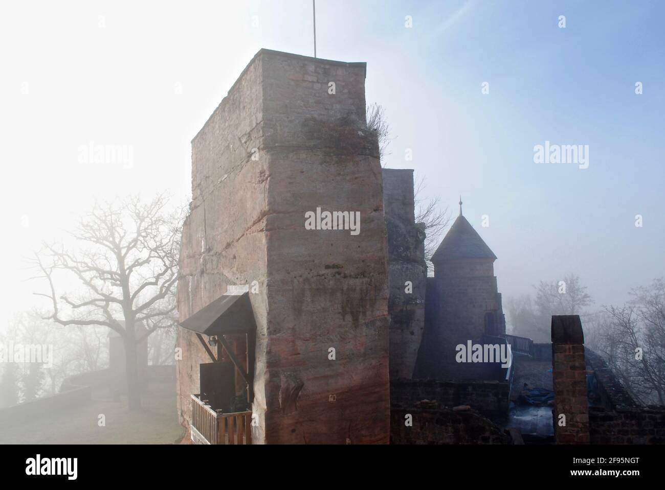 LANDSTUHL, GERMANY: Burg Nanstein (Nanstein Castle) in Landstuhl, Germany on a foggy, misty morning. A wooden balcony on a stone wall. Stock Photo