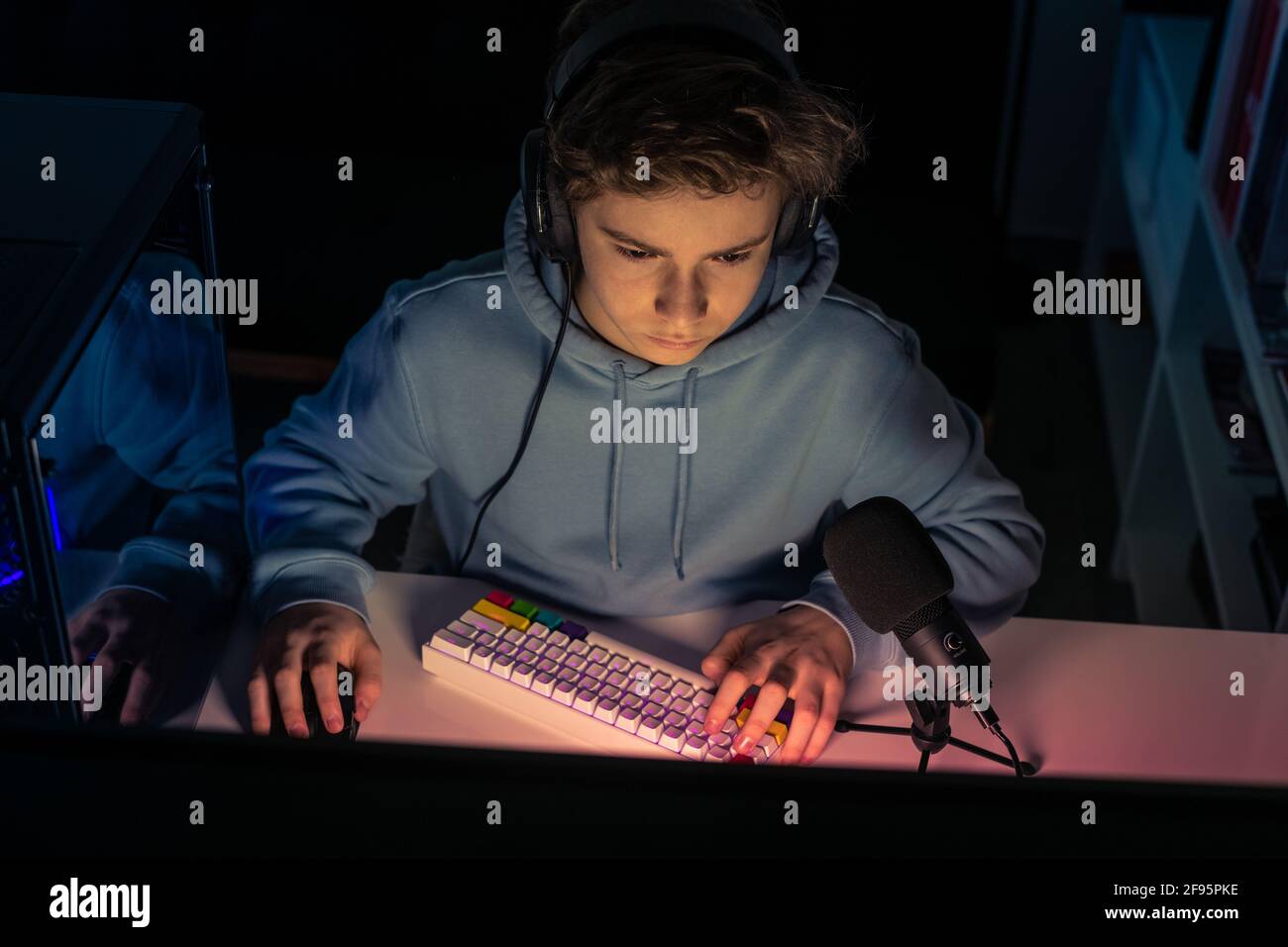 Video game streamers playing on their home console. Teenager playing