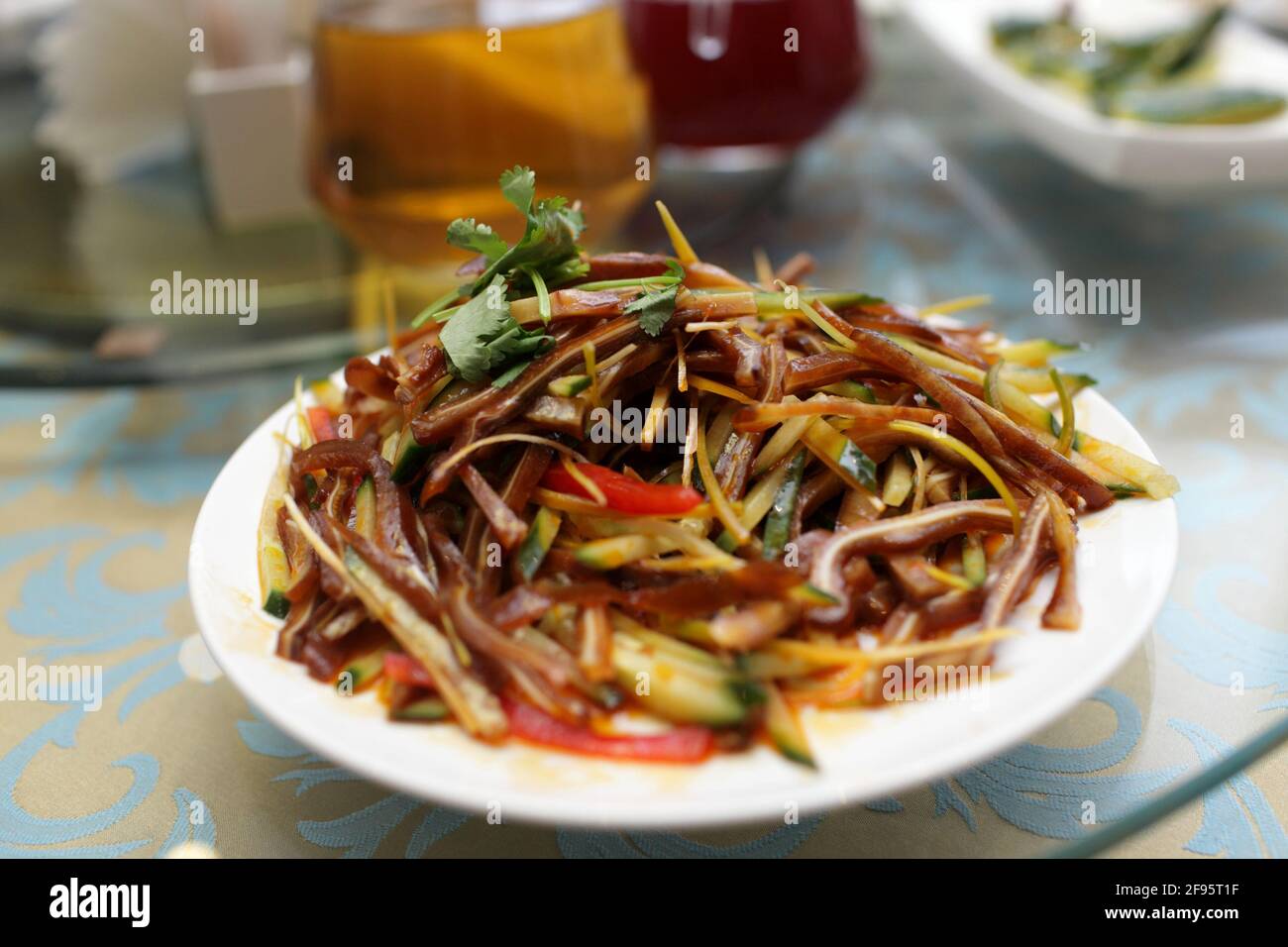 Fragrant pig ears in aromatic sauce at chinese restaurant Stock Photo