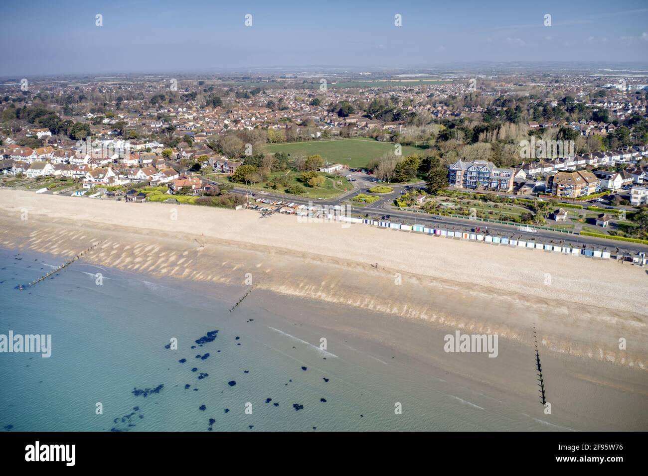 A row of brightly coloured beach huts in Bognor Regis with Marine Park