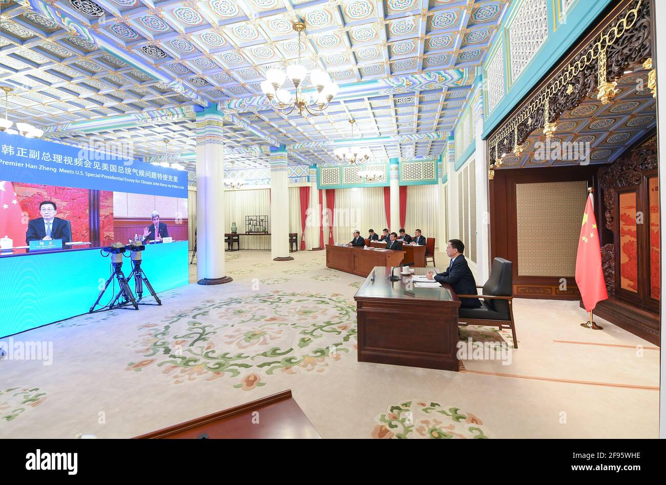 (210416) -- BEIJING, April 16, 2021 (Xinhua) -- Chinese Vice Premier Han Zheng, also a member of the Standing Committee of the Political Bureau of the Communist Party of China Central Committee, meets with visiting U.S. Special Presidential Envoy for Climate John Kerry via video link in Beijing, capital of China, April 16, 2021. (Xinhua/Zhang Ling) Stock Photo