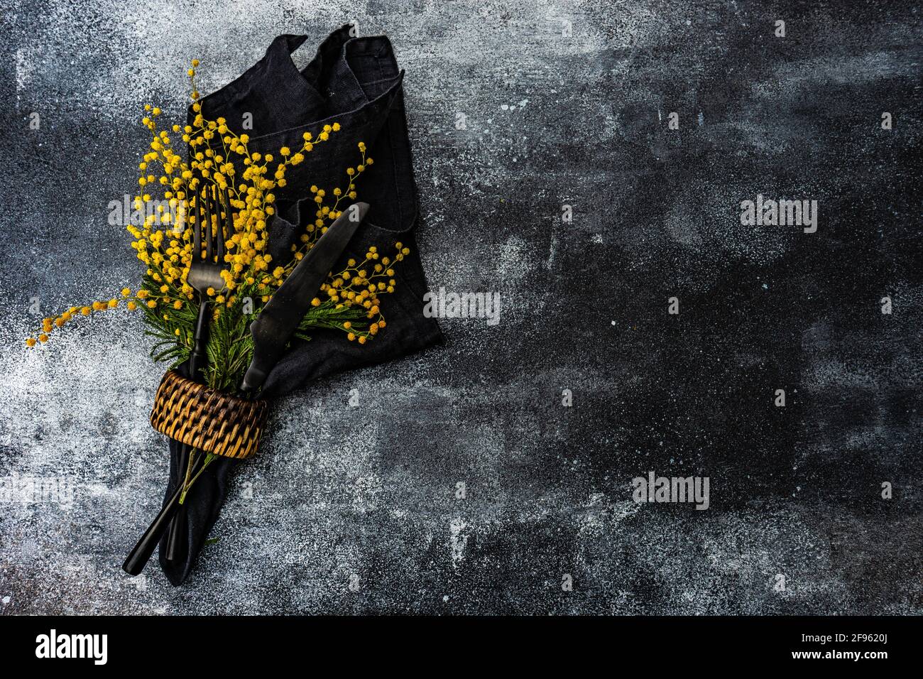 Spring mimosa flowers and table setting Stock Photo