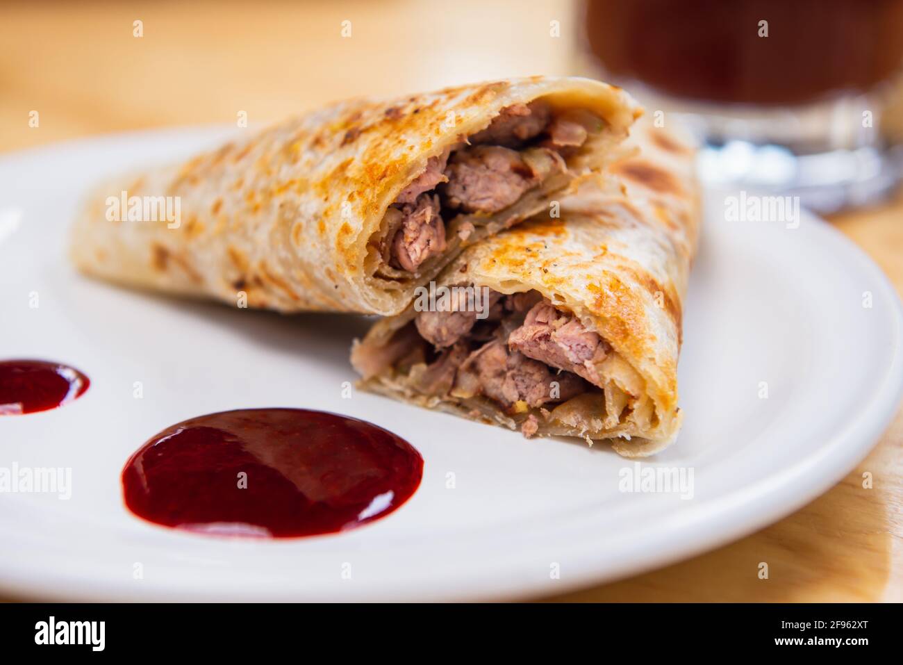 Mexican burrito and michelada beer with tomato juice with copy space