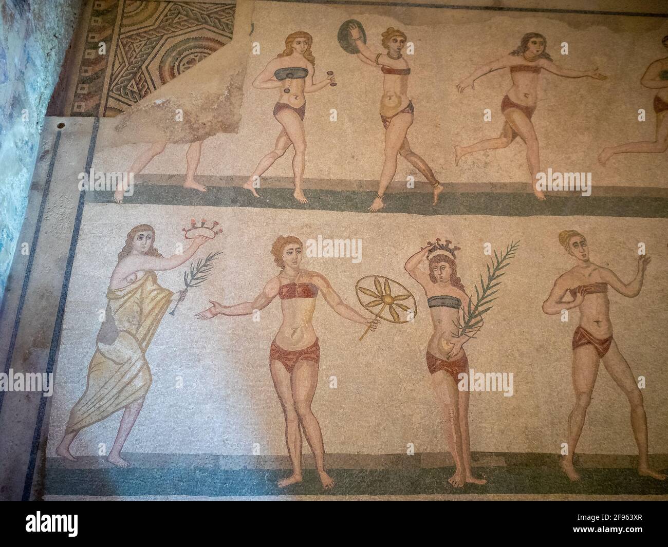 Women playing sports, mosaic detail from the Room with Girls in Bikini, Villa Romana del Casale Stock Photo