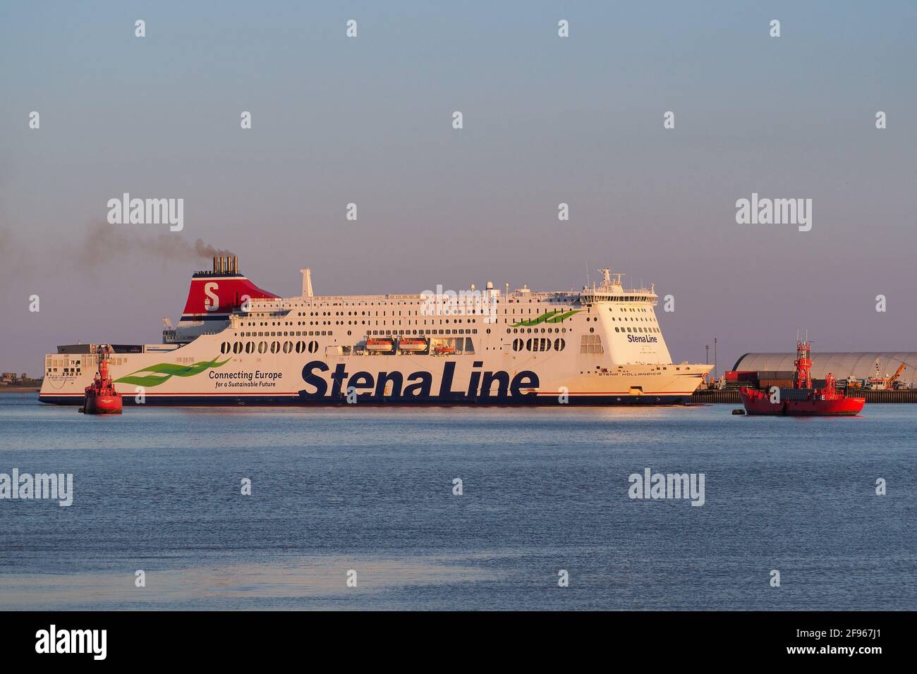 Harwich, Essex, ferry Stena Hollandica passing the dockside and red lightships Stock Photo