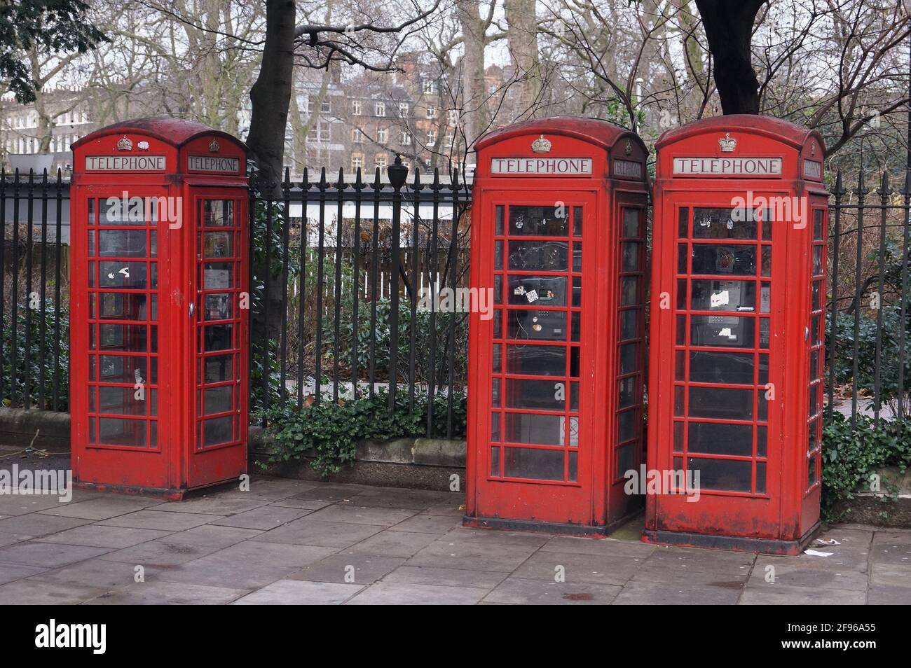 Three traditional red British telephone boxes in Russel Square, London (UK) Stock Photo