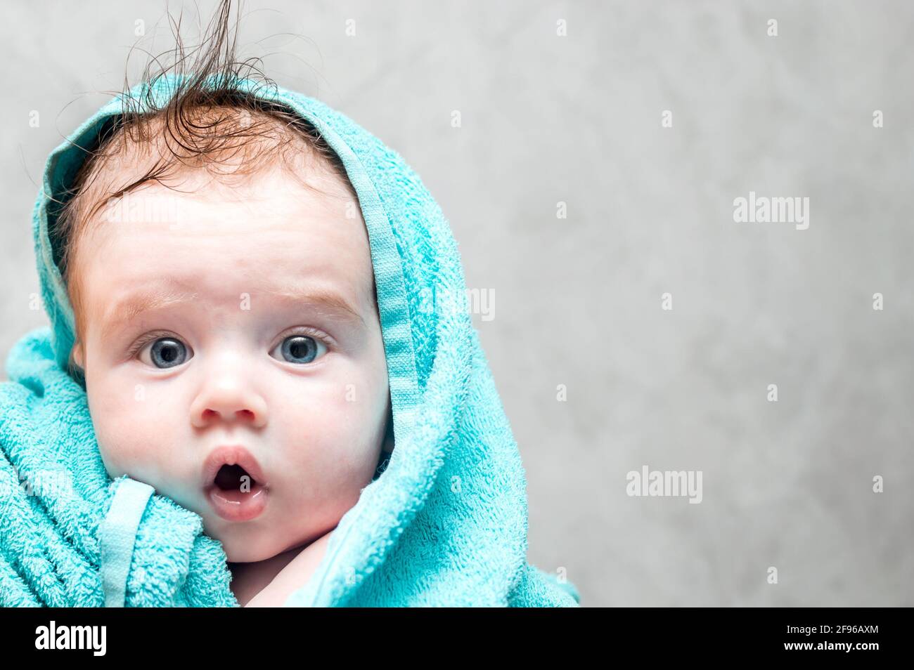 Closeup portrait of a baby after bathing. Baby Care Concept Stock Photo