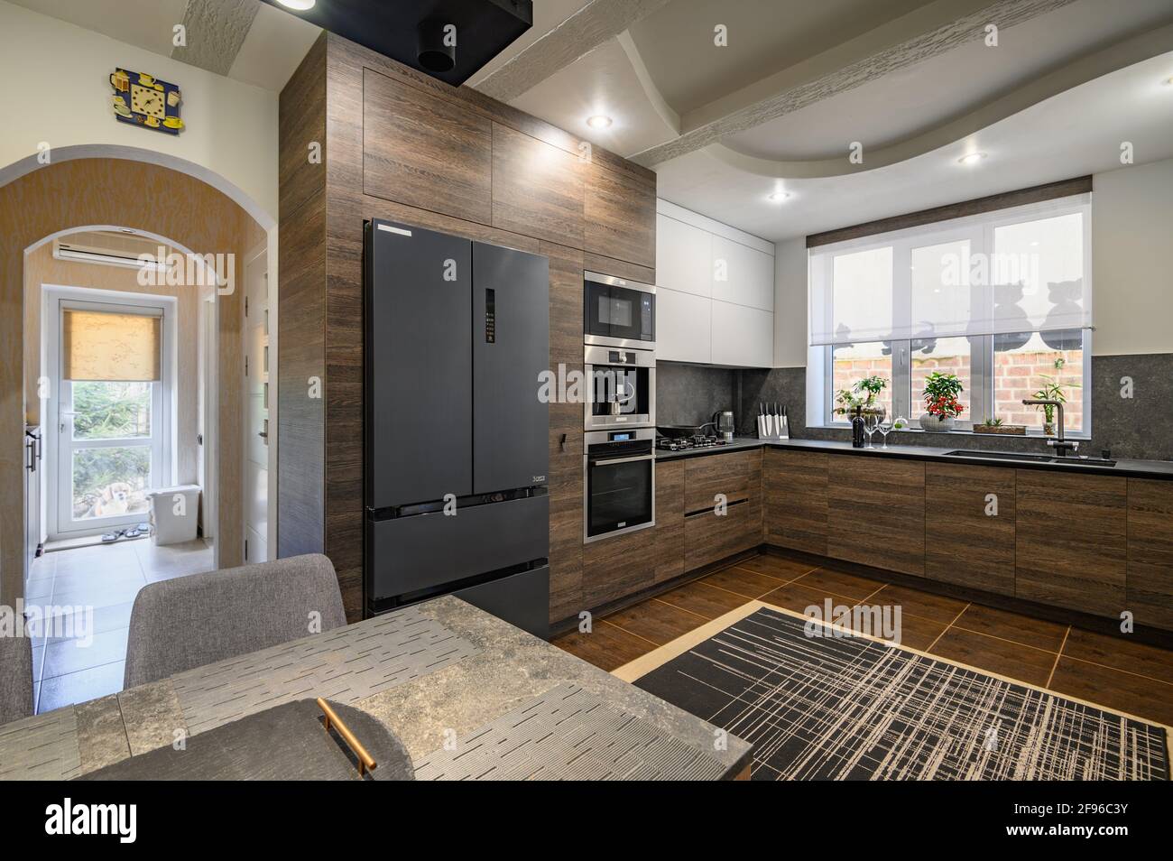 Modern luxurious dark brown, gray and black kitchen details Stock Photo