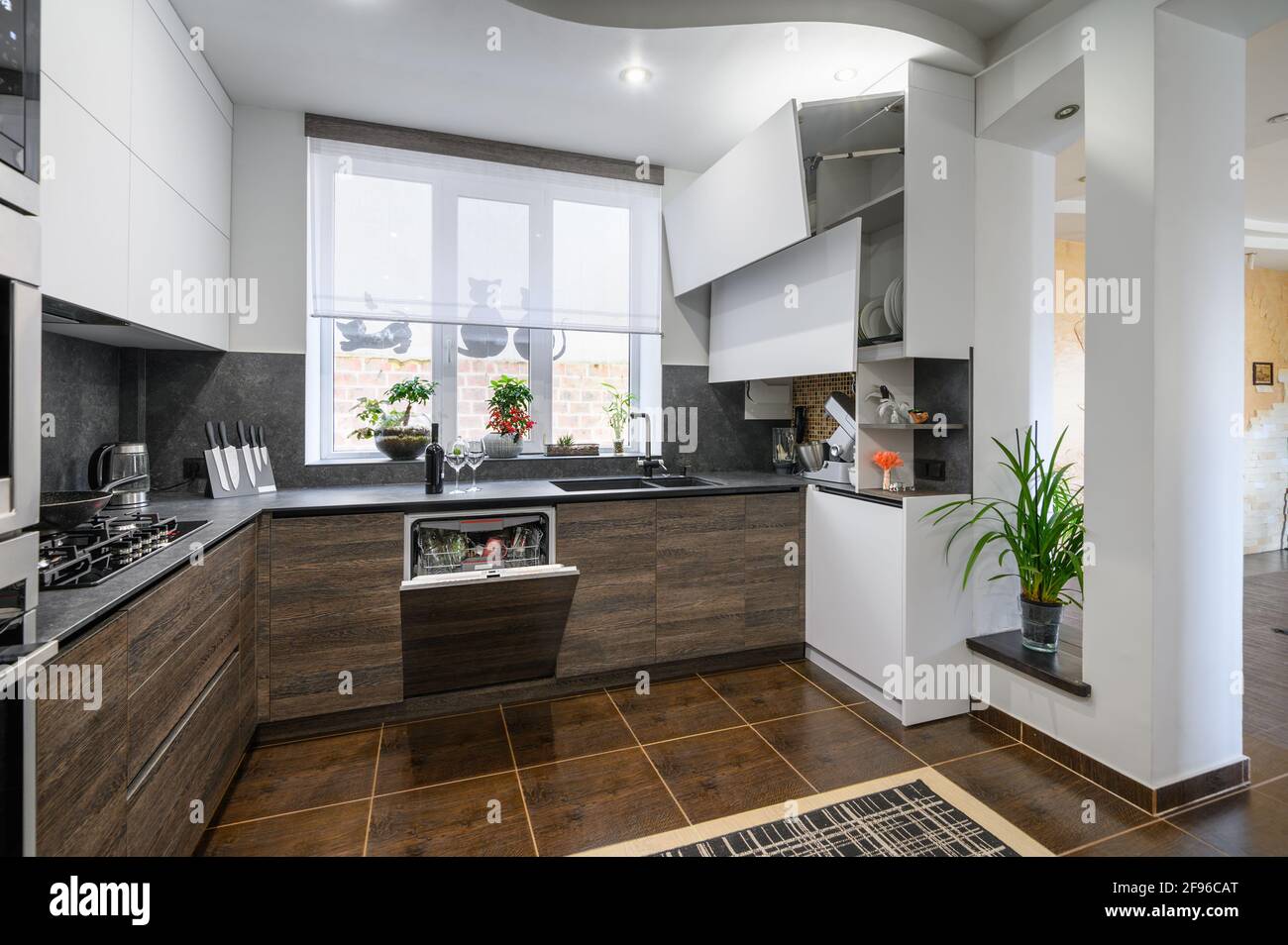 Modern luxurious dark brown, gray and black kitchen details Stock Photo