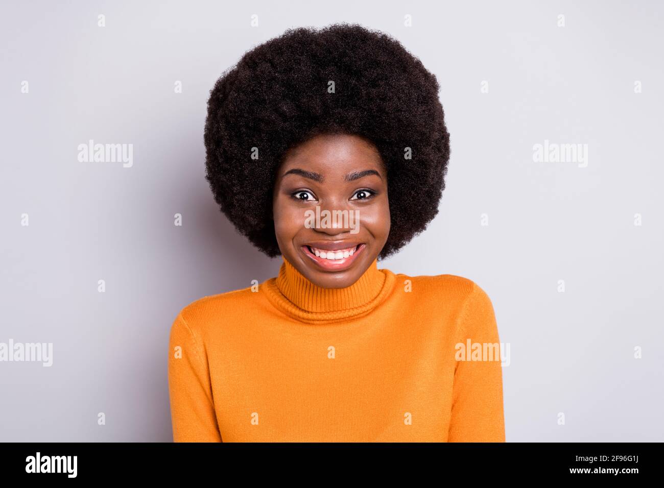 Photo of wavy hairdo young dark skin girl toothy smile wear roll neck  clothing isolated on grey color background Stock Photo - Alamy