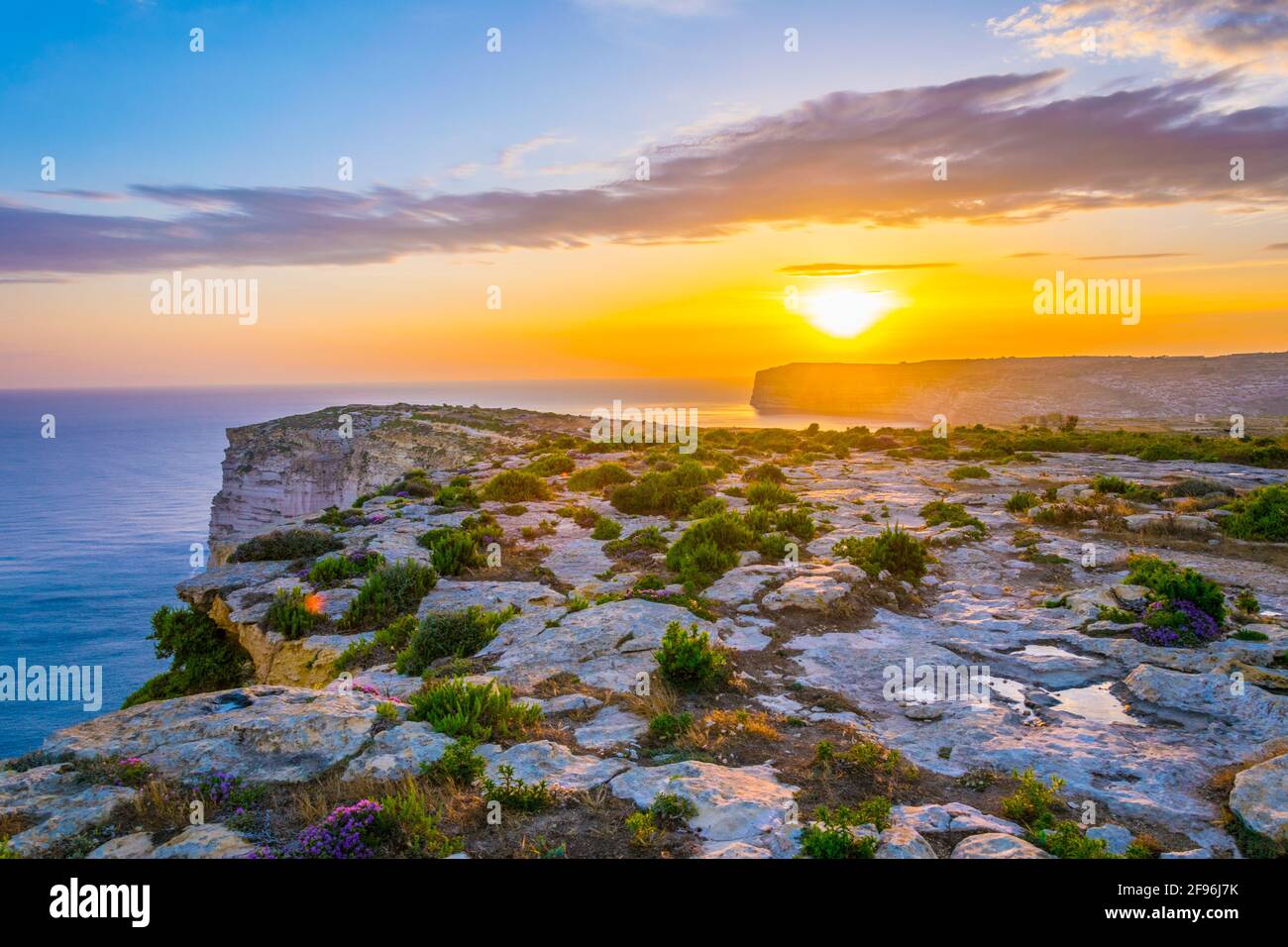 Sunset view over Ta Cenc cliffs on Gozo, Malta Stock Photo - Alamy