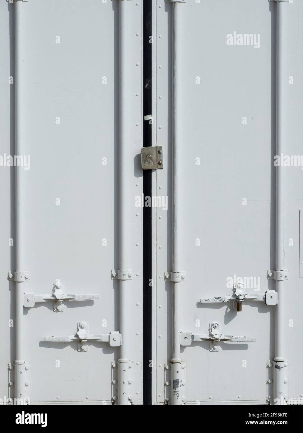 White doors of a closed shipping container Stock Photo