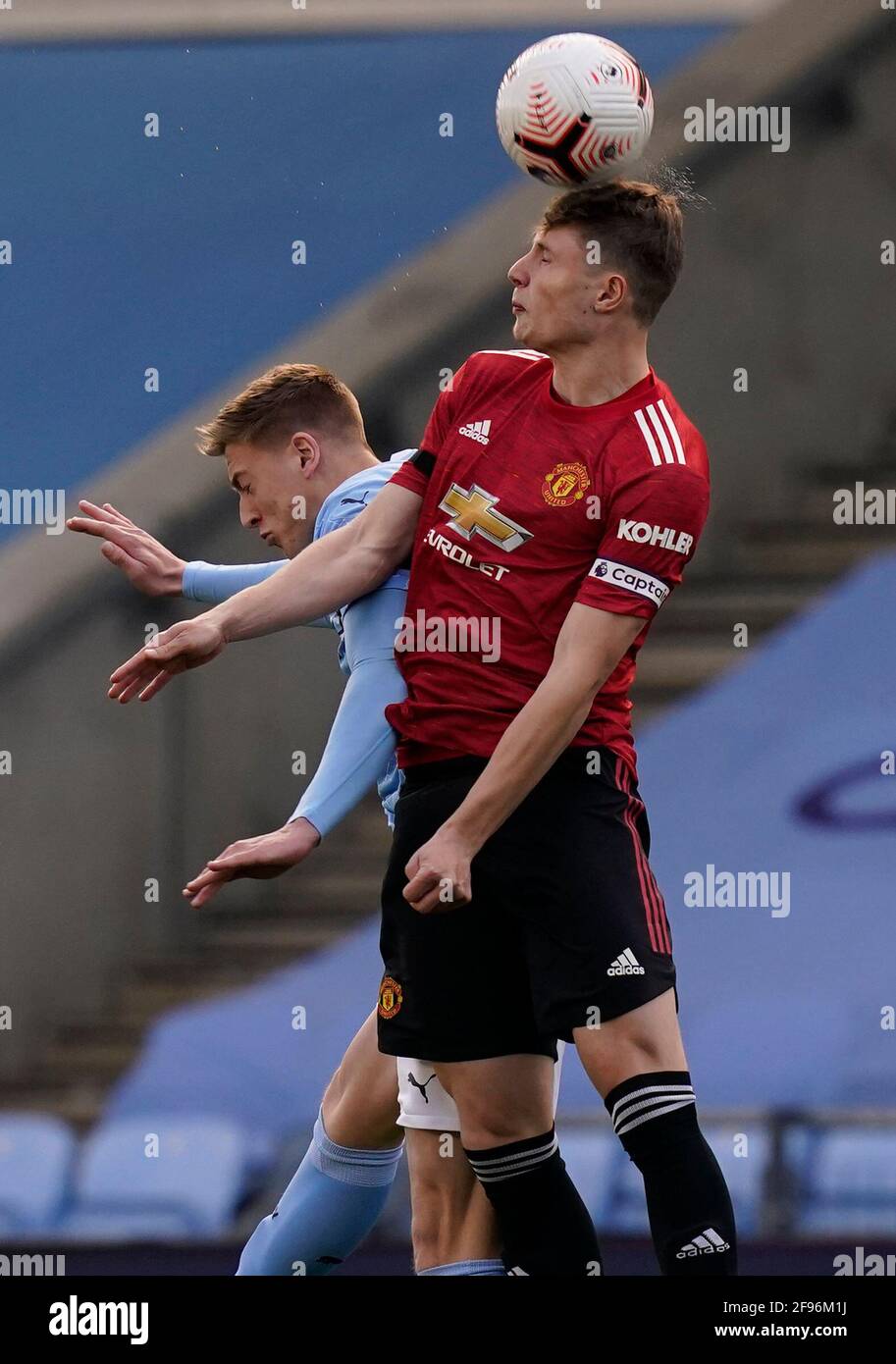 Manchester, England, 16th April 2021. Liam Delap of Manchester City challenged by Will Fish of Manchester Utdduring the Professional Development League match at Academy Stadium, Manchester. Picture credit should read: Andrew Yates / Sportimage Stock Photo