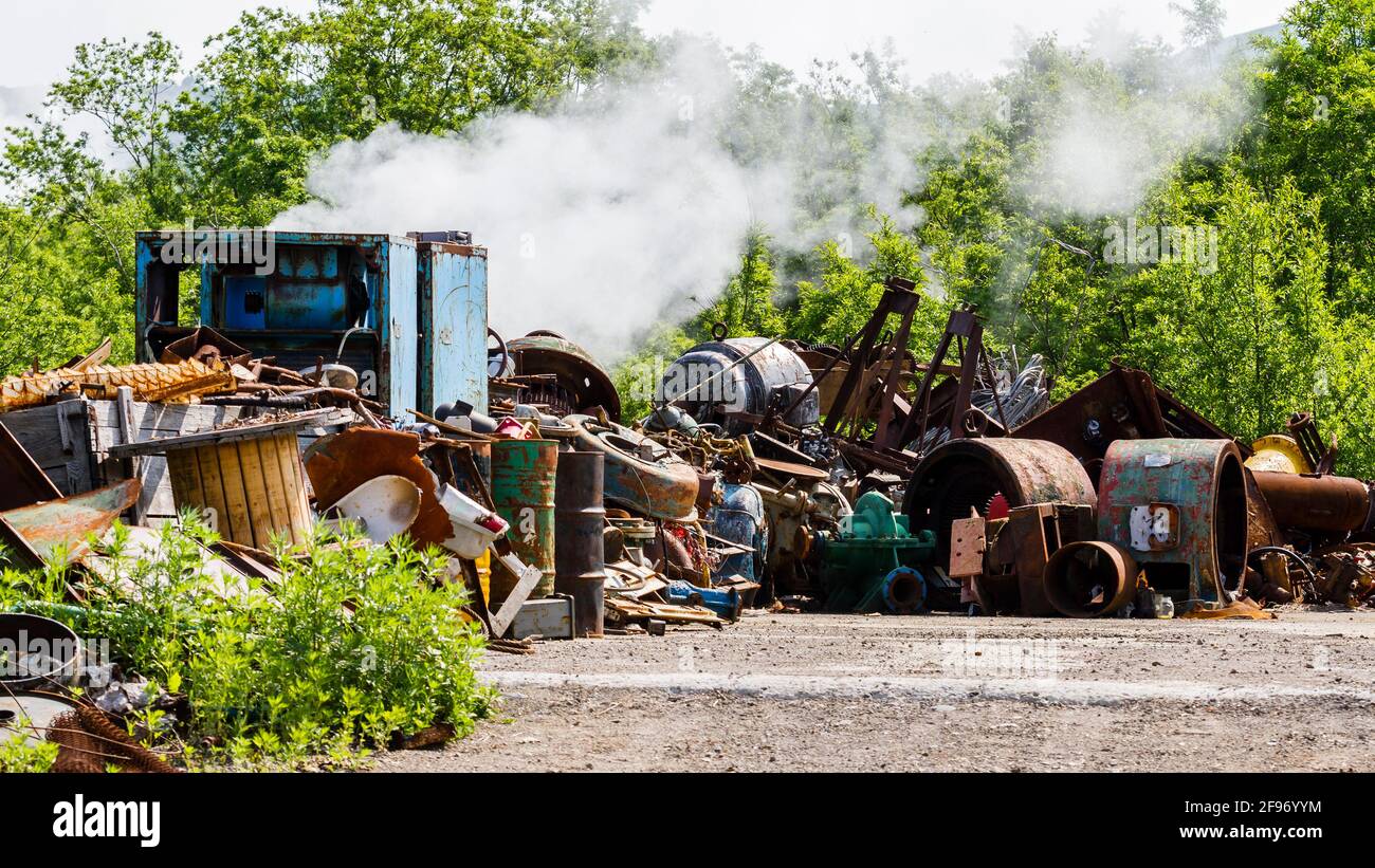 Illegal garbage dump. Large pile of metal, wooden and plastic waste. Stock Photo