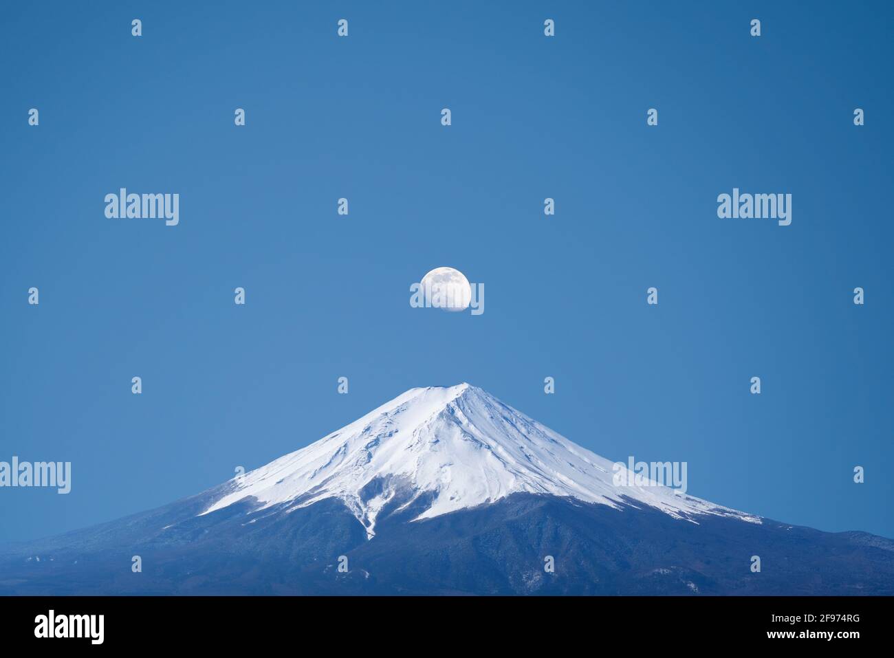 Stunning view of the moon over Mt. Fuji, Lake Kawaguchi, Fujikawaguchiko Japan Stock Photo