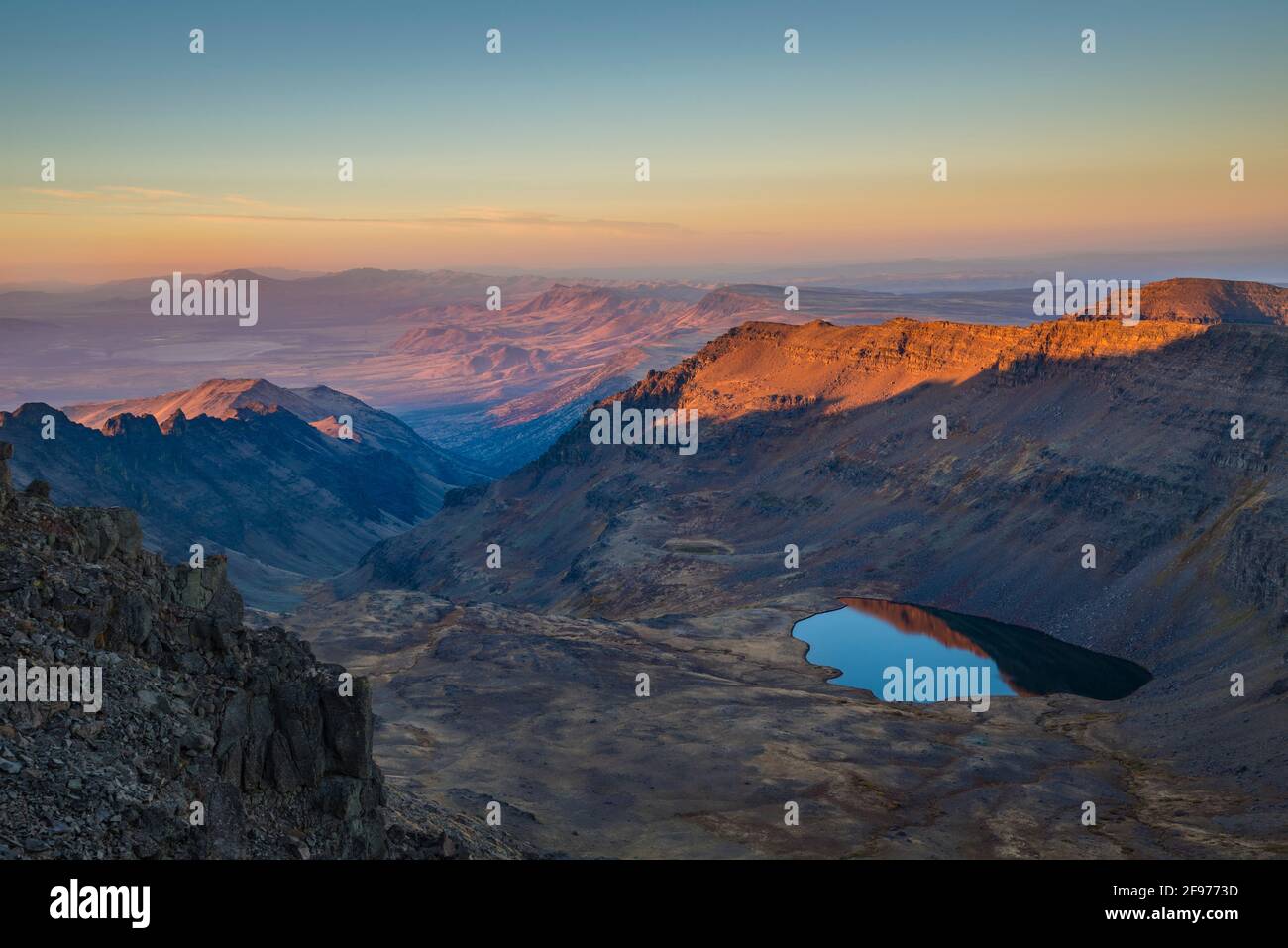 Wildhorse Lake and the Alvord Desert from the summit of Steens Mountain in southeastern Oregon. Stock Photo