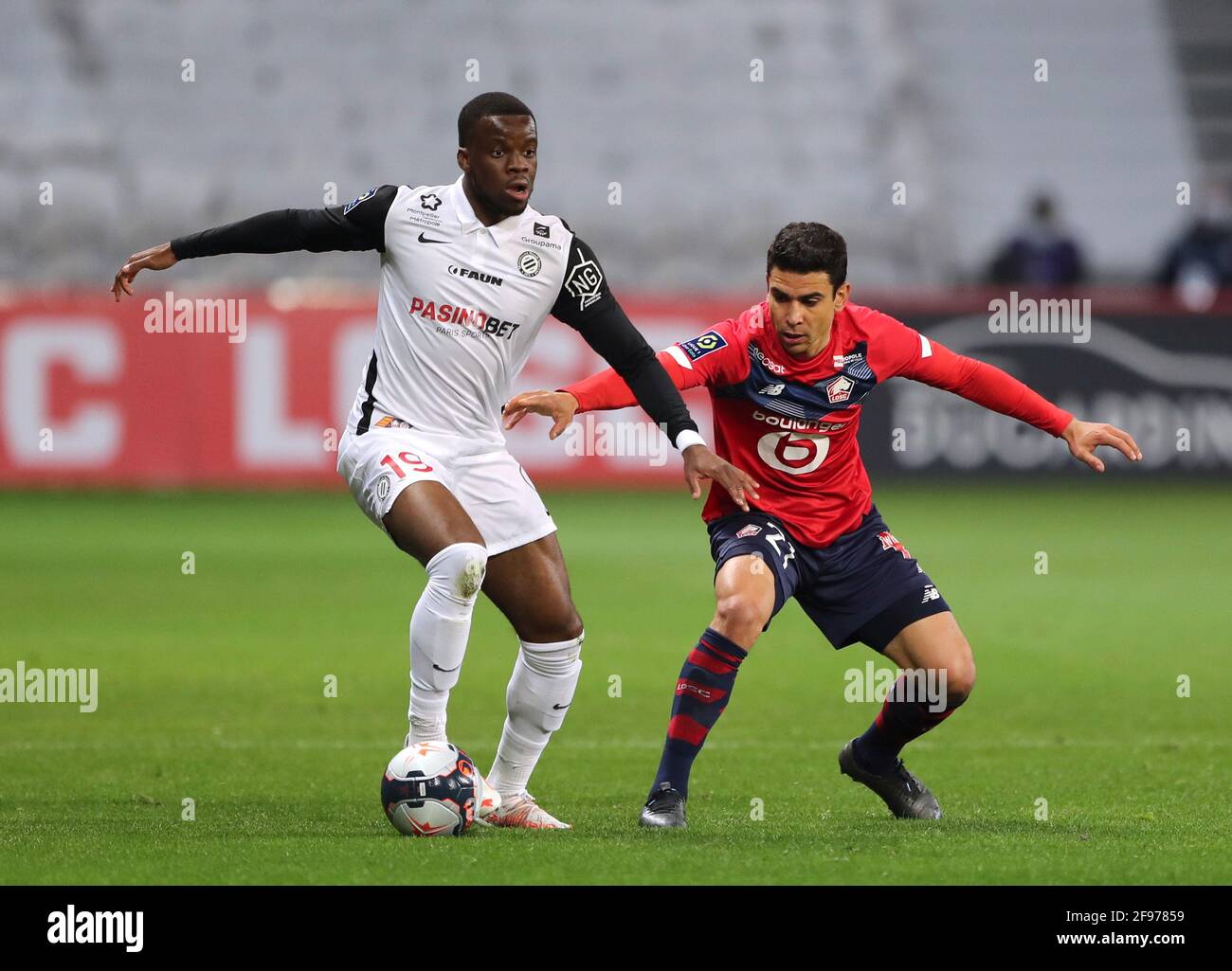 Soccer Football - Ligue 1 - Lille v Montpellier - Stade Pierre-Mauroy, Lille,  France - April 16, 2021 Montpellier's Stephy Mavididi in action with Lille's  Benjamin Andre REUTERS/Pascal Rossignol Stock Photo - Alamy