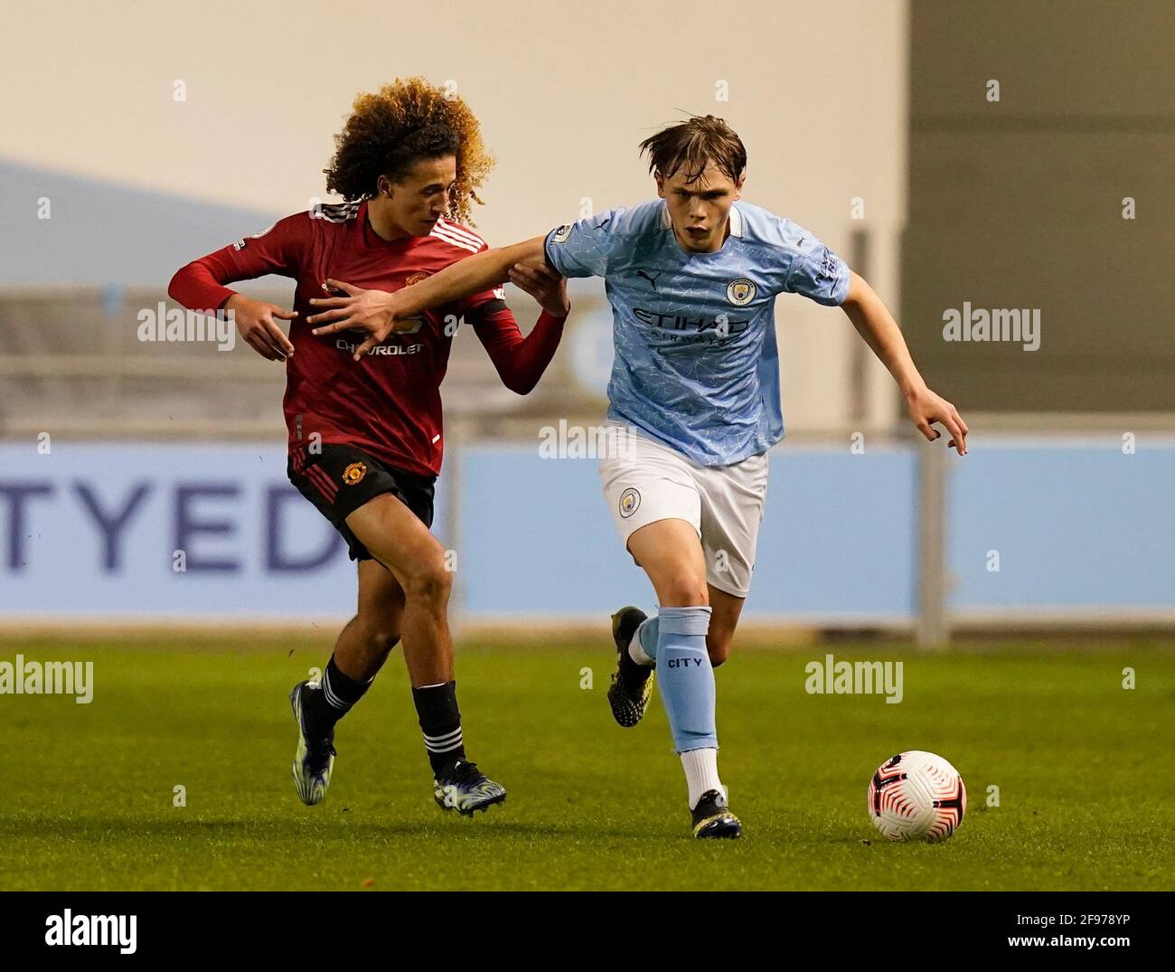 Manchester, England, 16th April 2021. Callum Doyle of Manchester City tackled by Hannibal Mejbri of Manchester Utdduring the Professional Development League match at Academy Stadium, Manchester. Picture credit should read: Andrew Yates / Sportimage Stock Photo