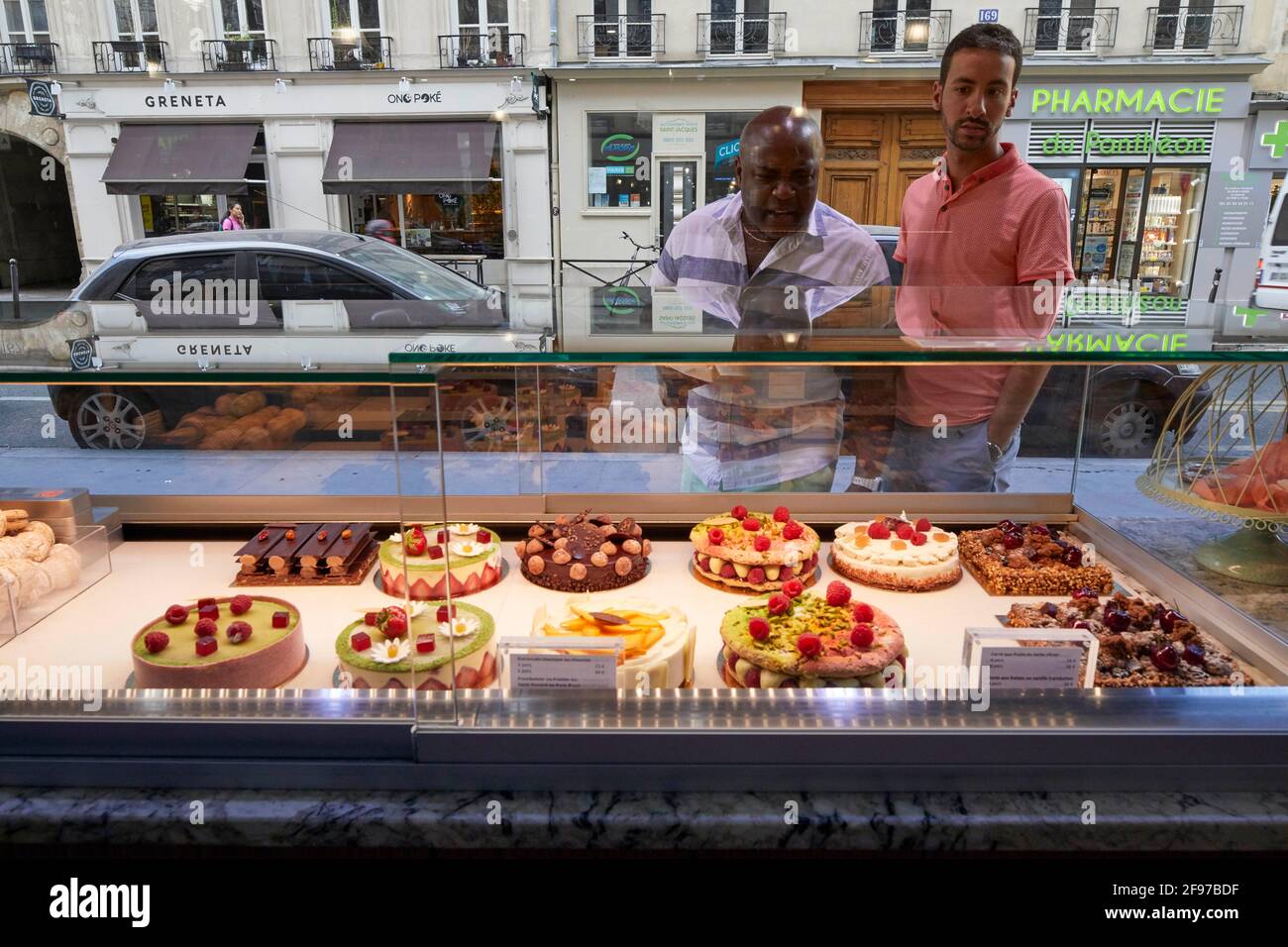 Customers looing at pastry at Patisserie Sebastien Degardin on Rue Saint Jacques Paris France Stock Photo