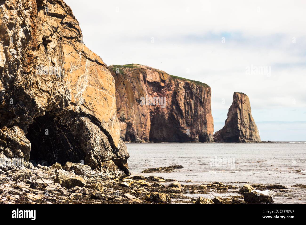 The huge sheer rock formations in the Gulf of Saint Lawrence on the tip of the Gaspé Peninsula in Québec, Canada. Stock Photo
