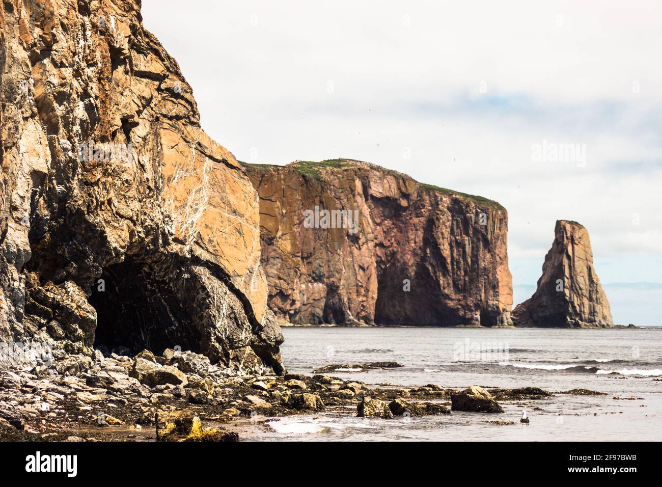 The huge sheer rock formations in the Gulf of Saint Lawrence on the tip of the Gaspé Peninsula in Québec, Canada. Stock Photo