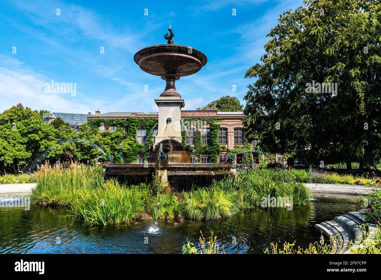 Fountain and the classic facade of a buiding of the Lund University in