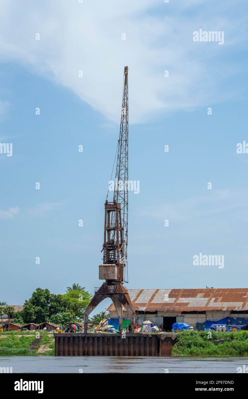 DRC: A broken crane, just some of the remnants of Bumba's recently functioning harbour, now quickly decaying in the punishing tropical conditions. Stock Photo