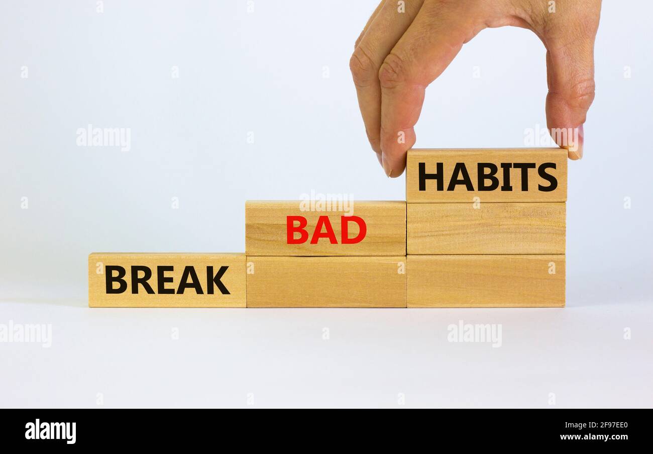 Break bad habits symbol. Wooden blocks with words 'break bad habits ...