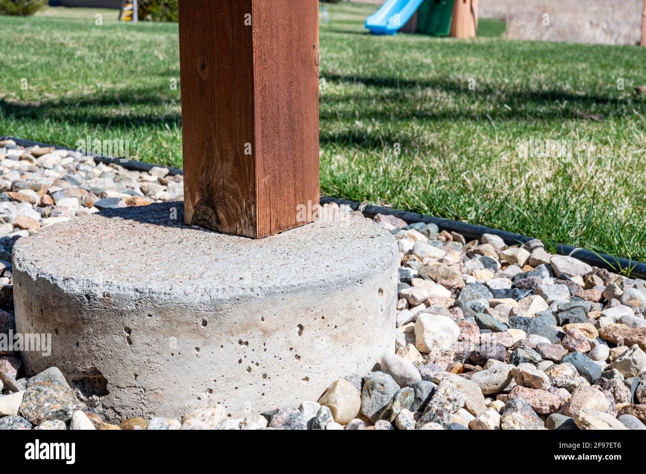 concrete tube footing used to transfer support from a suspended wooden