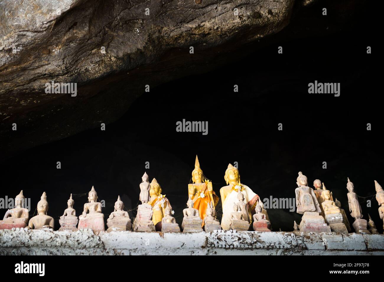 Laos, Pak Ou caves, Tham Ting, statues, Stock Photo