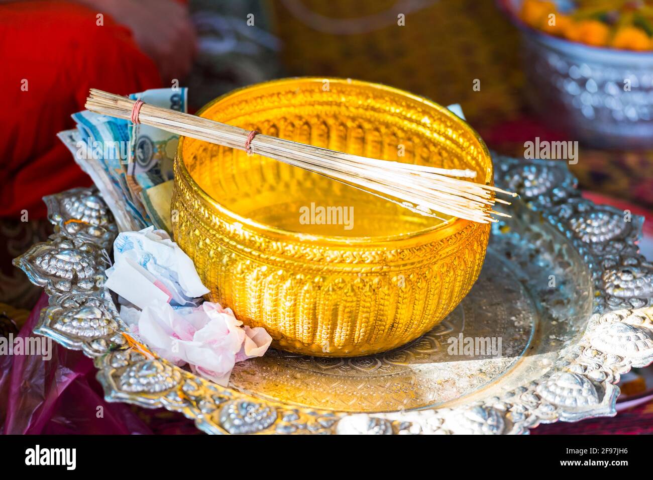Laos, Vientiane, the Vat Simuang temple, offering bowl Stock Photo