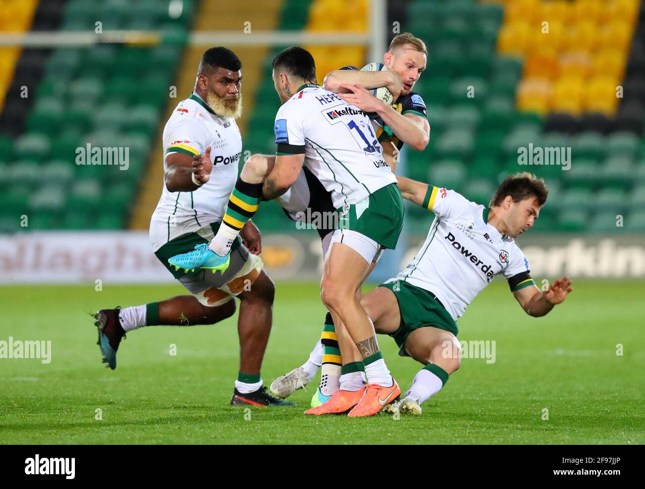 Northampton Saints' Rory Hutchinson is tackled by London Irish's Terrence Hepetema during the Gallagher Premiership match at Franklin's Gardens, Northampton. Picture date: Friday April 16, 2021. Stock Photo
