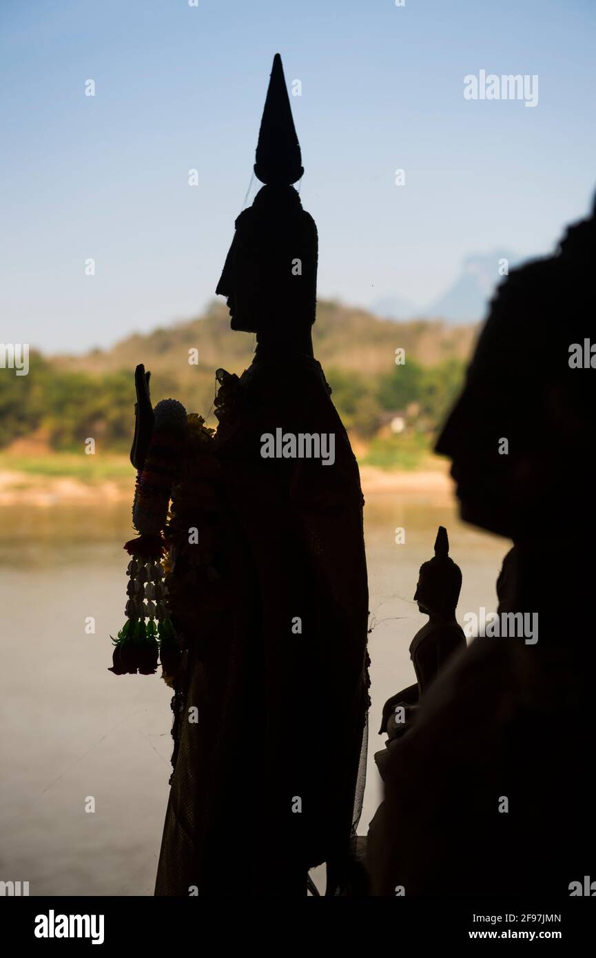 Laos, Pak Ou Caves, Tham Ting, Buddha statues Stock Photo