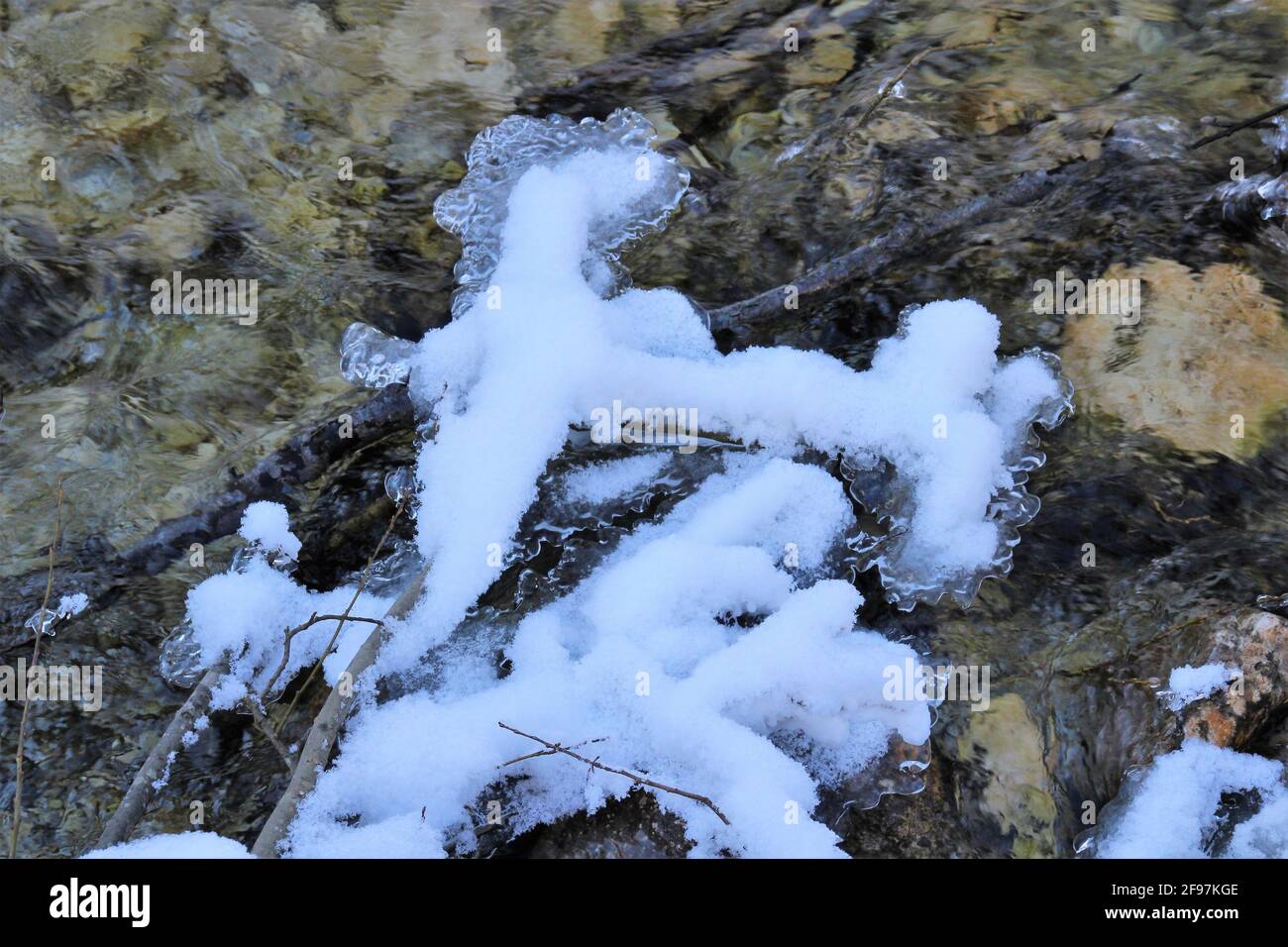 Winter in Werdenfelser Land, winter hike to Elmau. quiet stream in a snowy winter landscape, ice formation. Europe, Germany, Bavaria, Upper Bavaria, Werdenfelser Land, Mittenwald Stock Photo