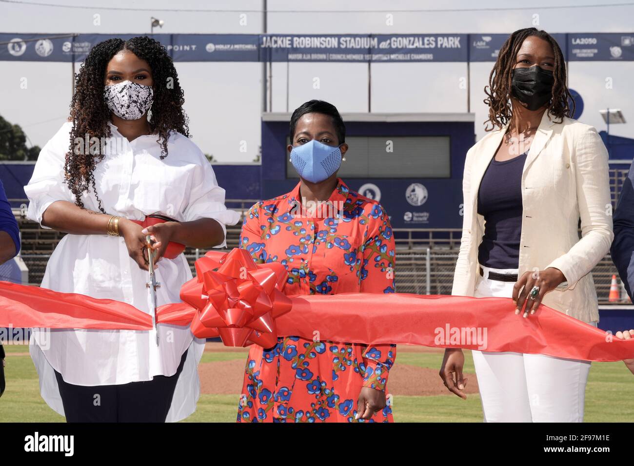 City of Compton mayor Aja Brown (left), Los Angeles Dodgers Foundation chief executive officer Nichol Whiteman and Ayo Robinson participate in  Dreamf Stock Photo