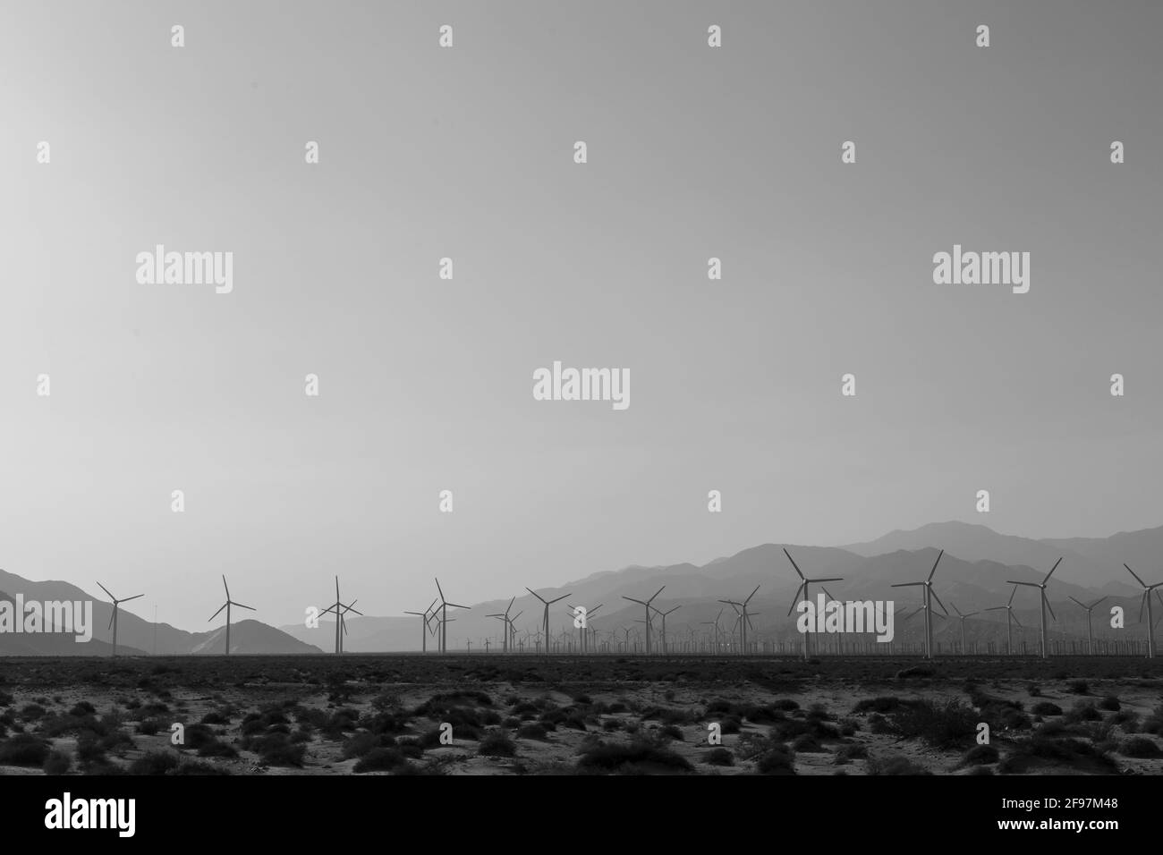 Black and White shot of Windmills turbines for electric power production, near Palm Springs, California, USA. Simple of clean energy Stock Photo