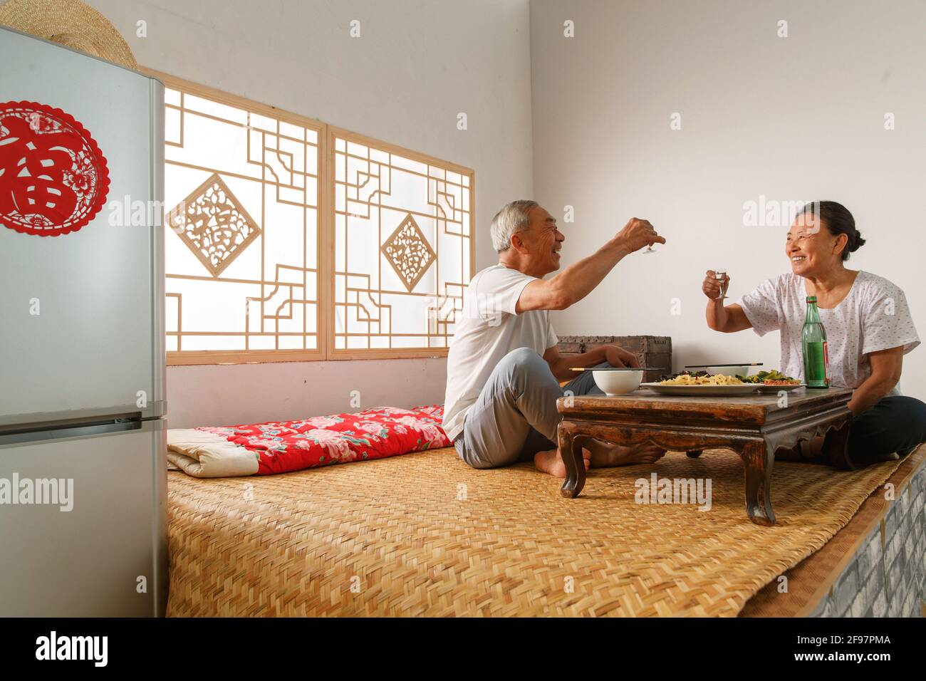 Elderly couple at home for dinner Stock Photo Alamy
