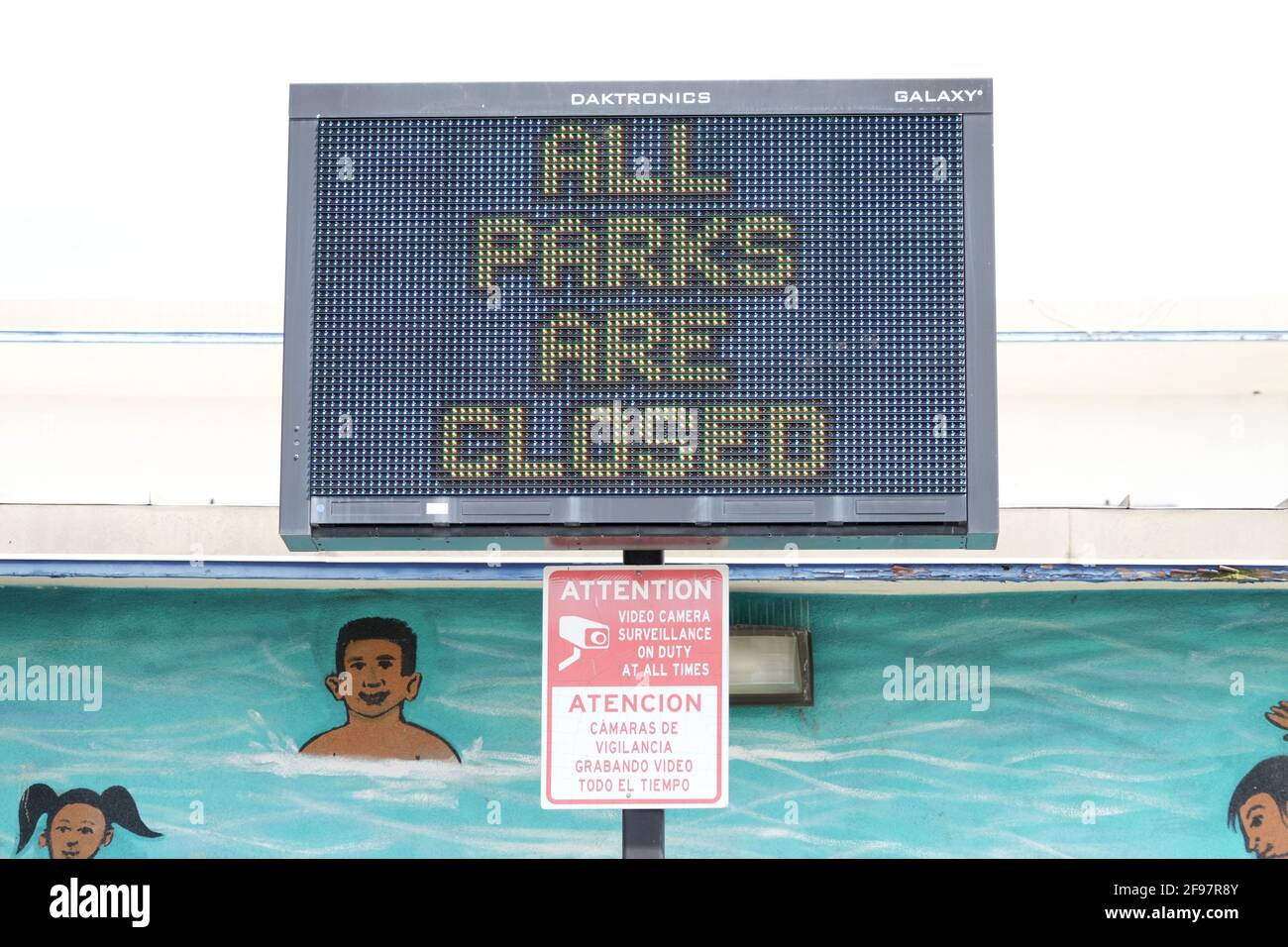 An All Parks are Closed message on the video board at Gonzales Park, Thursday, April 15, 2021, in Compton, Calif. (Kirby Lee via AP) Stock Photo