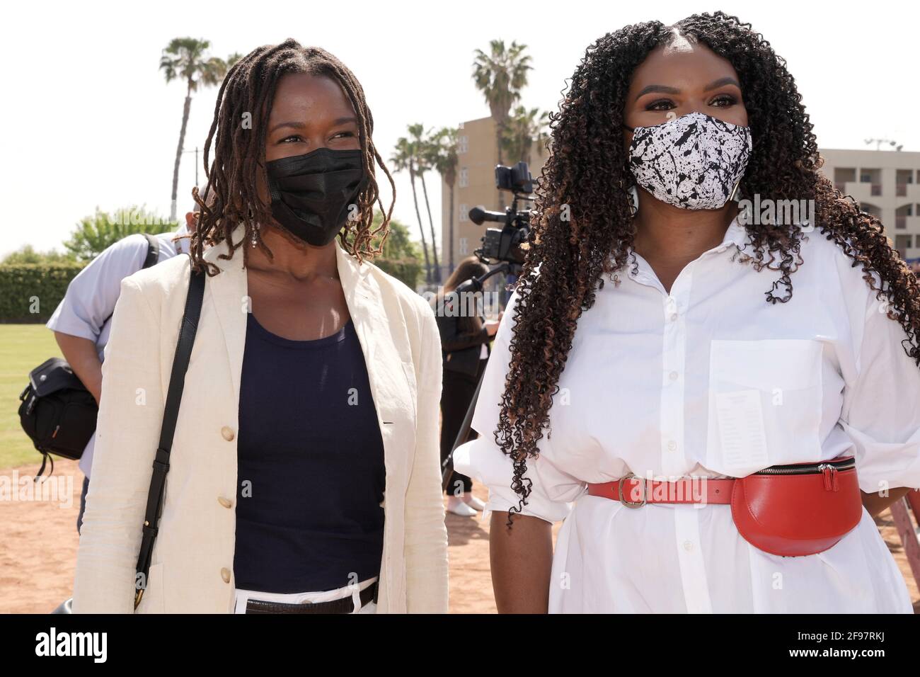 Ayo Robinson (left) and Compton mayor Aja Brown pose with face mask at  Los Angeles Dodgers Foundation Dreamfields ribbon-cutting ceremony at Gonzales Stock Photo