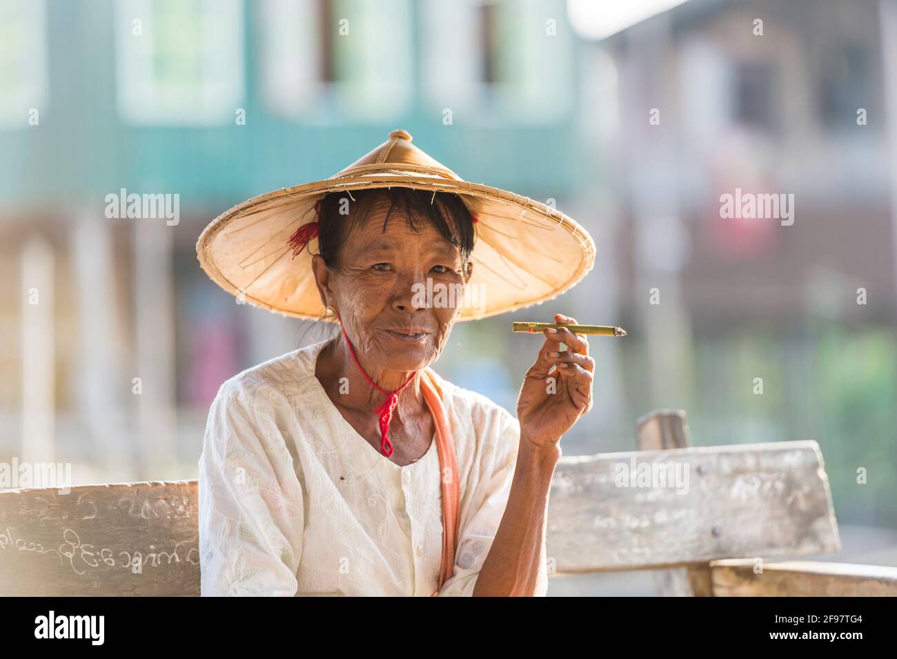 Myanmar, scenes at Inle Lake, in the pagoda forest Kakku, senior citizen, hat, cigarette, Stock Photo