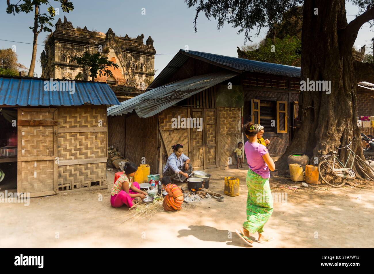 Myanmar, Inwa, Lay Htat Gyi Monastery, women, children, street, cooking Stock Photo