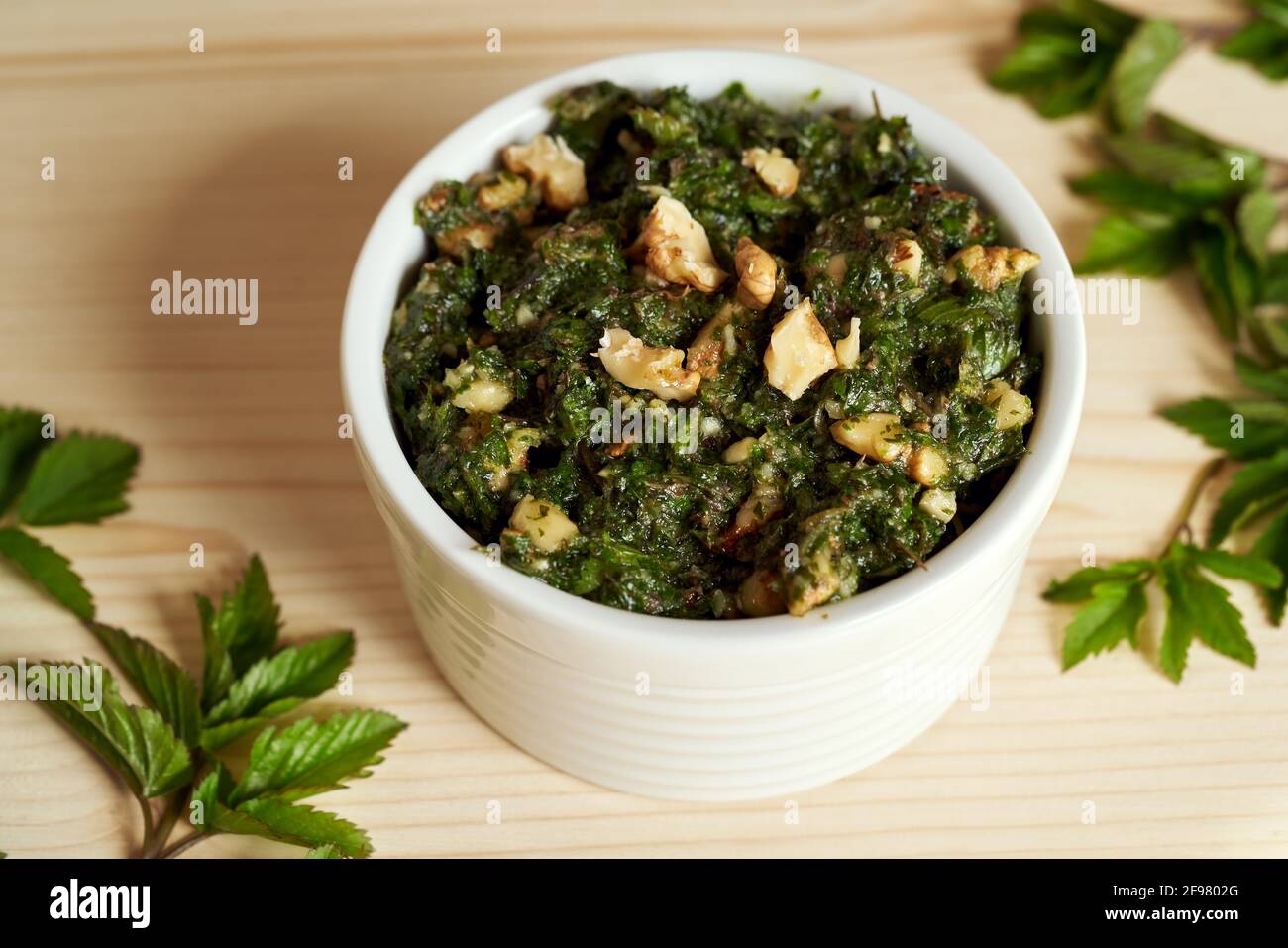 A cup of pesto made from young ground elder leaves - a wild edible