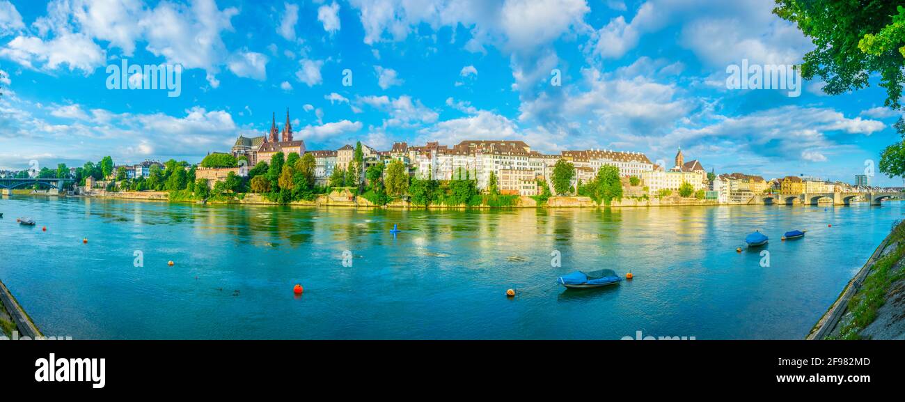 Riverside of Rhine in Basel dominated by majestic building of Munster ...