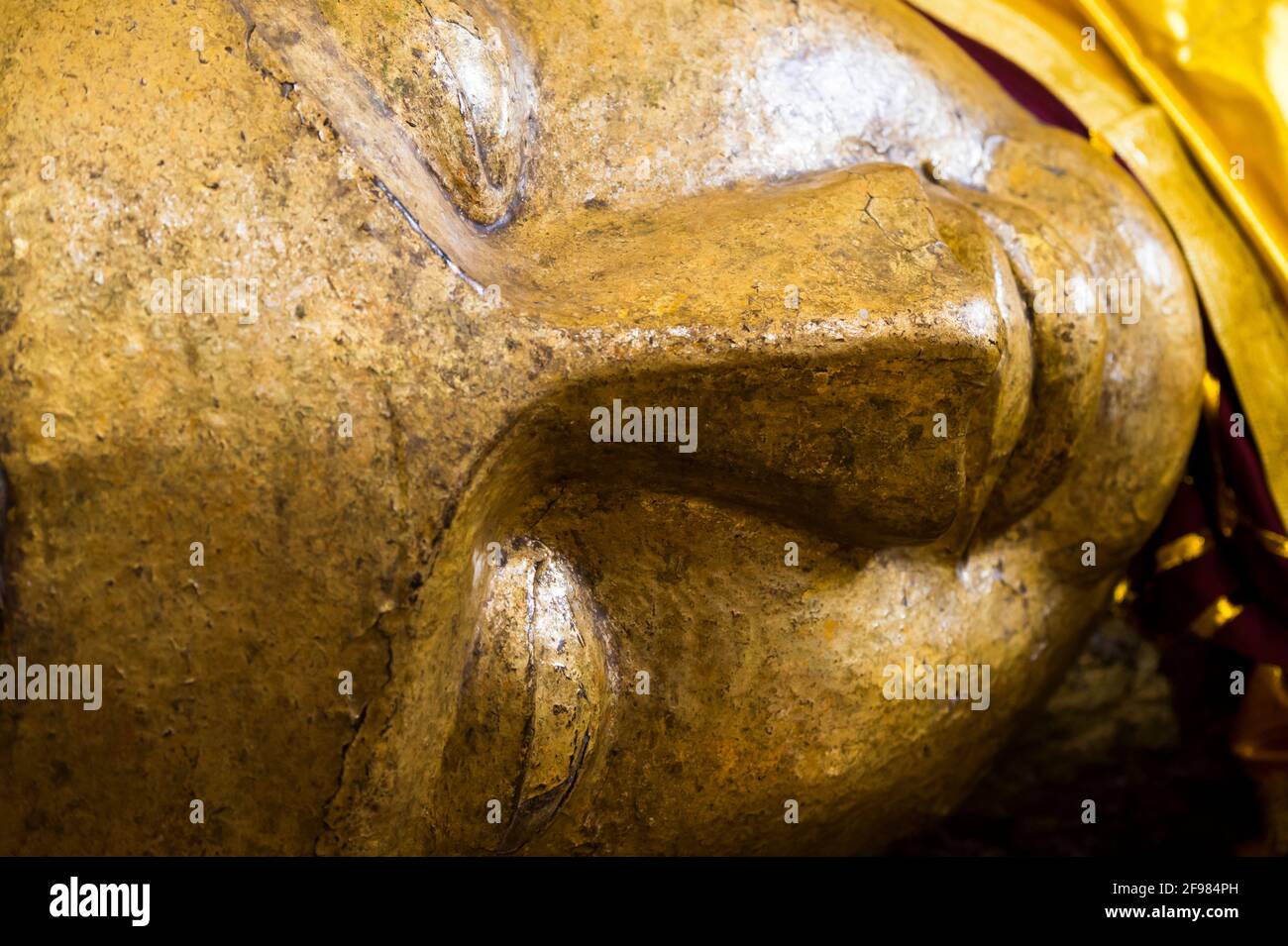 India, Kushinagara, Parinirvana temple and stupa, Buddha statue, golden, detail Stock Photo