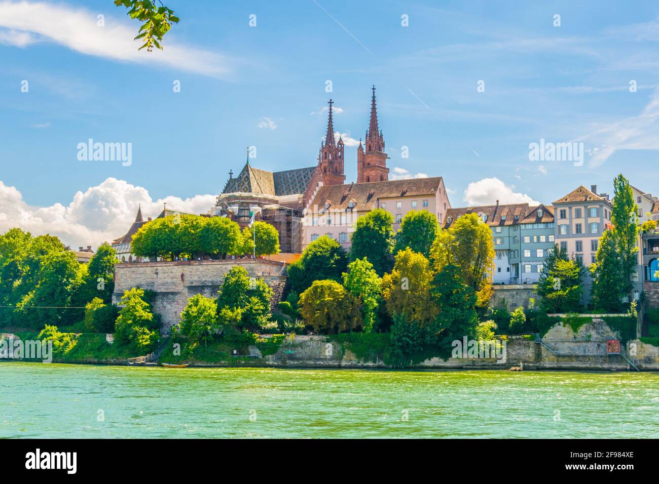 Riverside of Rhine in Basel dominated by majestic building of Munster ...