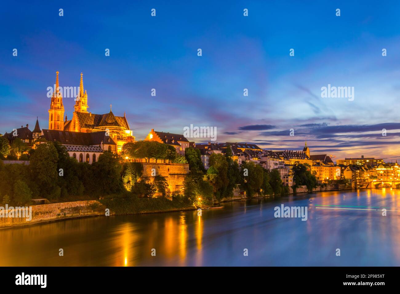 Sunset view of riverside of Rhine in Basel dominated by majestic ...