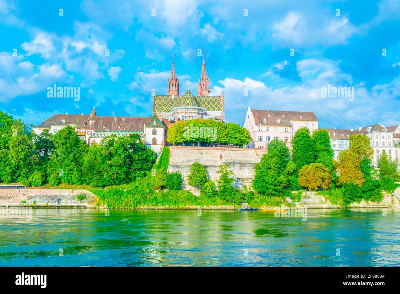 Riverside of Rhine in Basel dominated by majestic building of Munster ...
